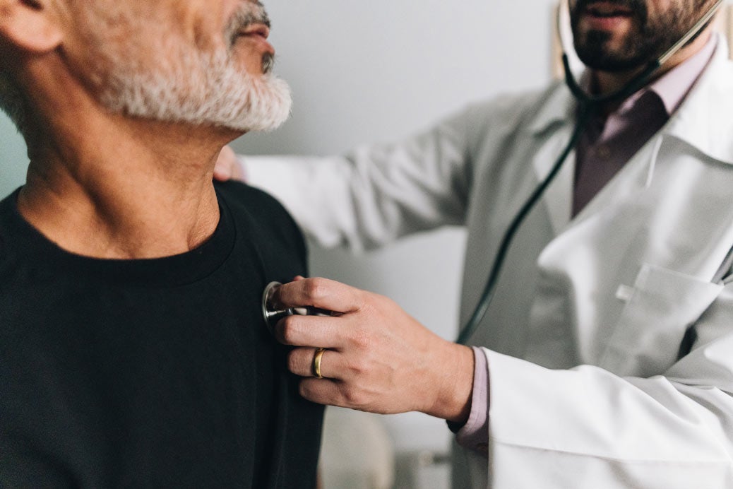 Man getting heart checked with doctor